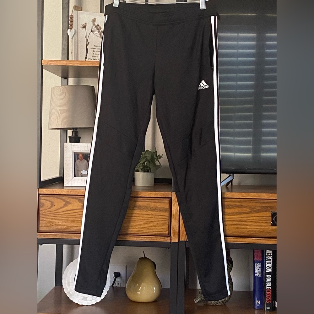 Women’s Adida’s Climacool Ankle Zip track pants with zip pockets.